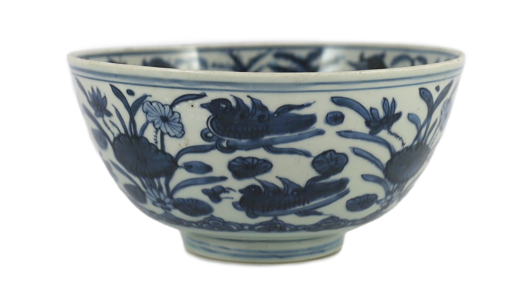 A Chinese Ming blue and white ‘lotus pond’ deep bowl, 21.5cm diameter, 10.5cm high, hairline crack to rim